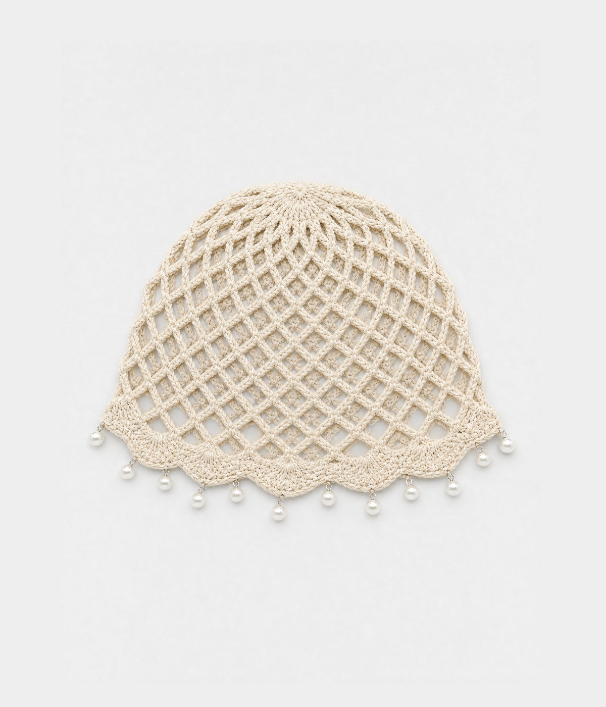 PEARL CROCHET CAP. open-mesh crochet cloche with pearl trim in beige, front view
