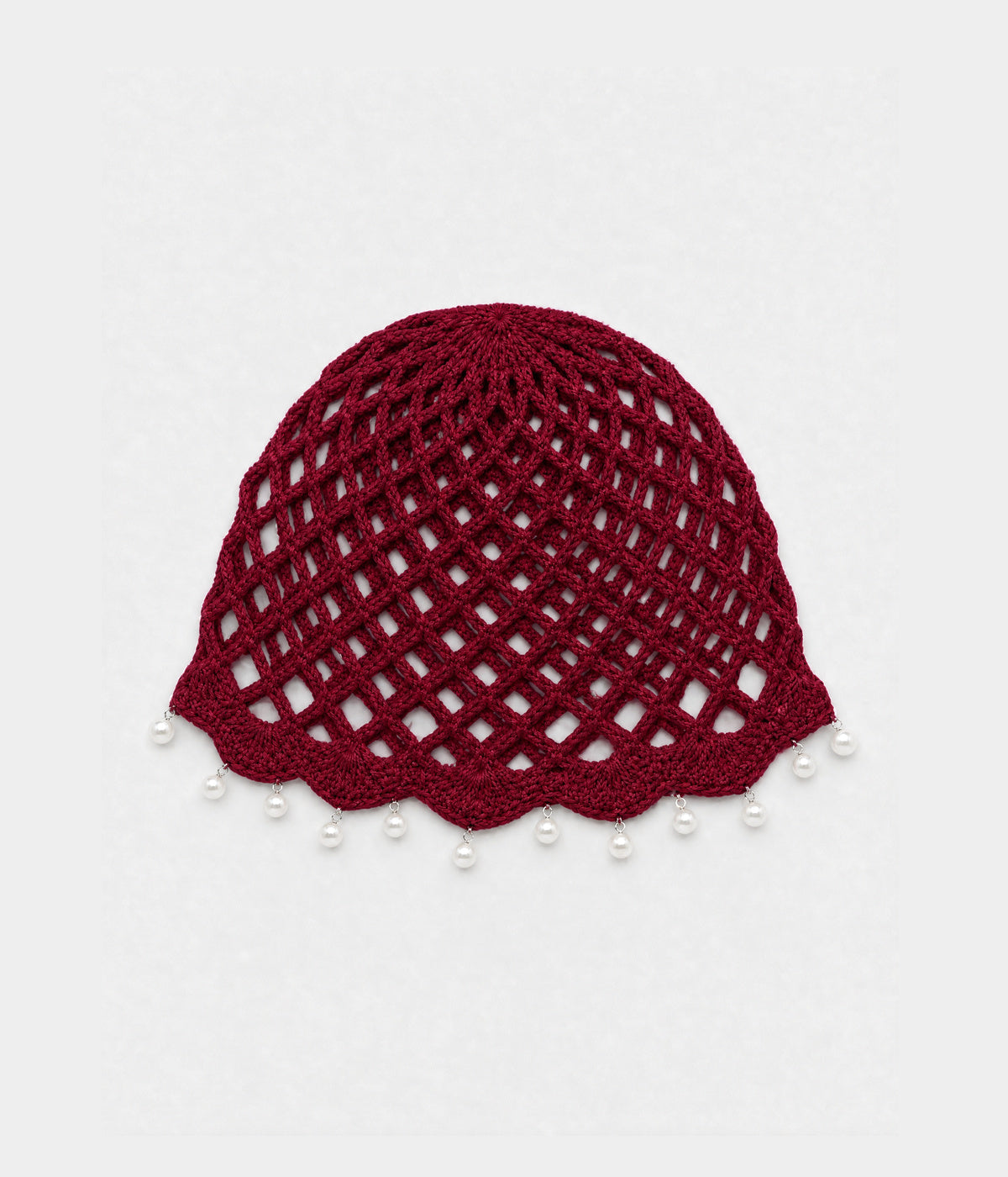 PEARL CROCHET CAP. open-mesh crochet cloche with pearl trim in red, front view