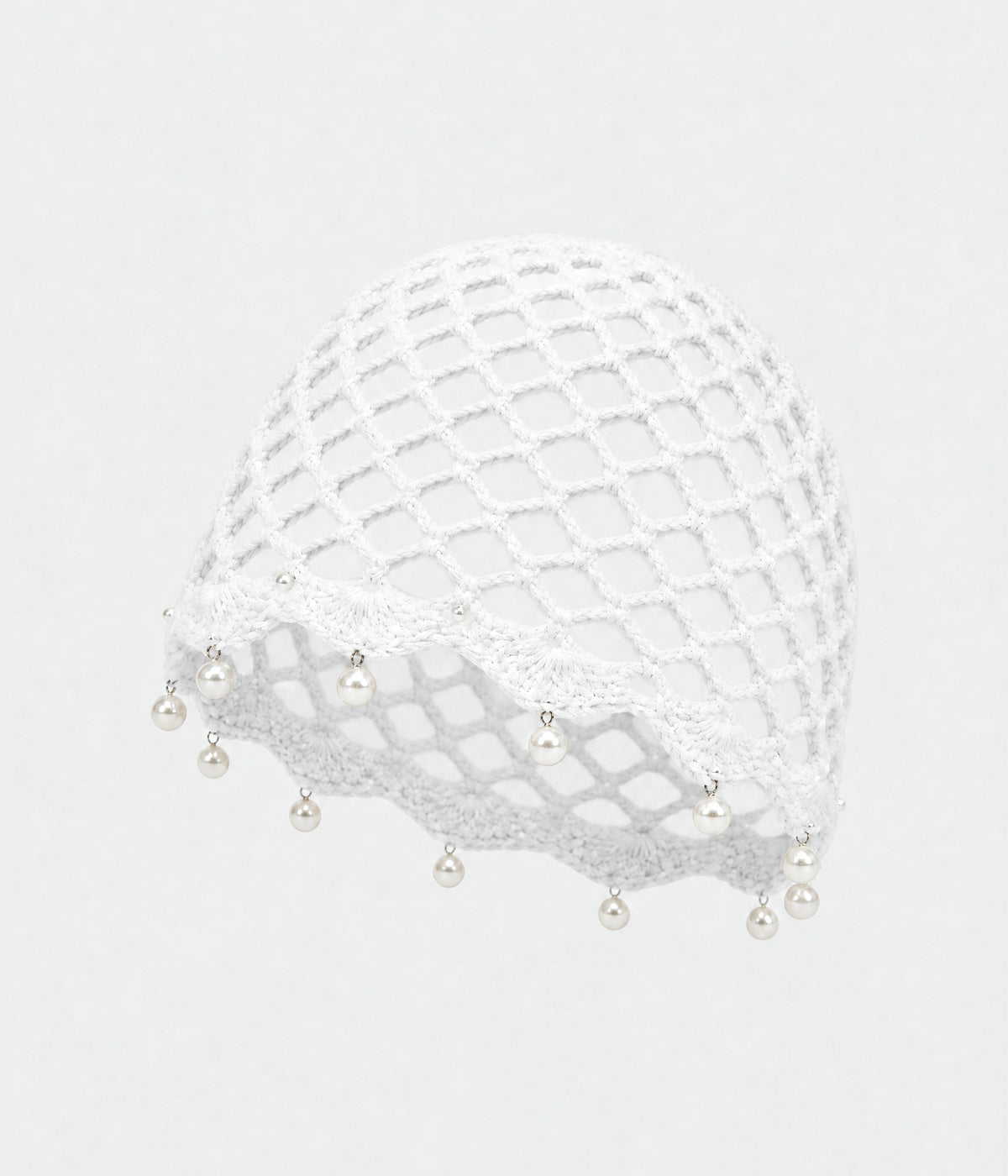 PEARL CROCHET CAP. open-mesh crochet cloche with pearl trim in white, front view
