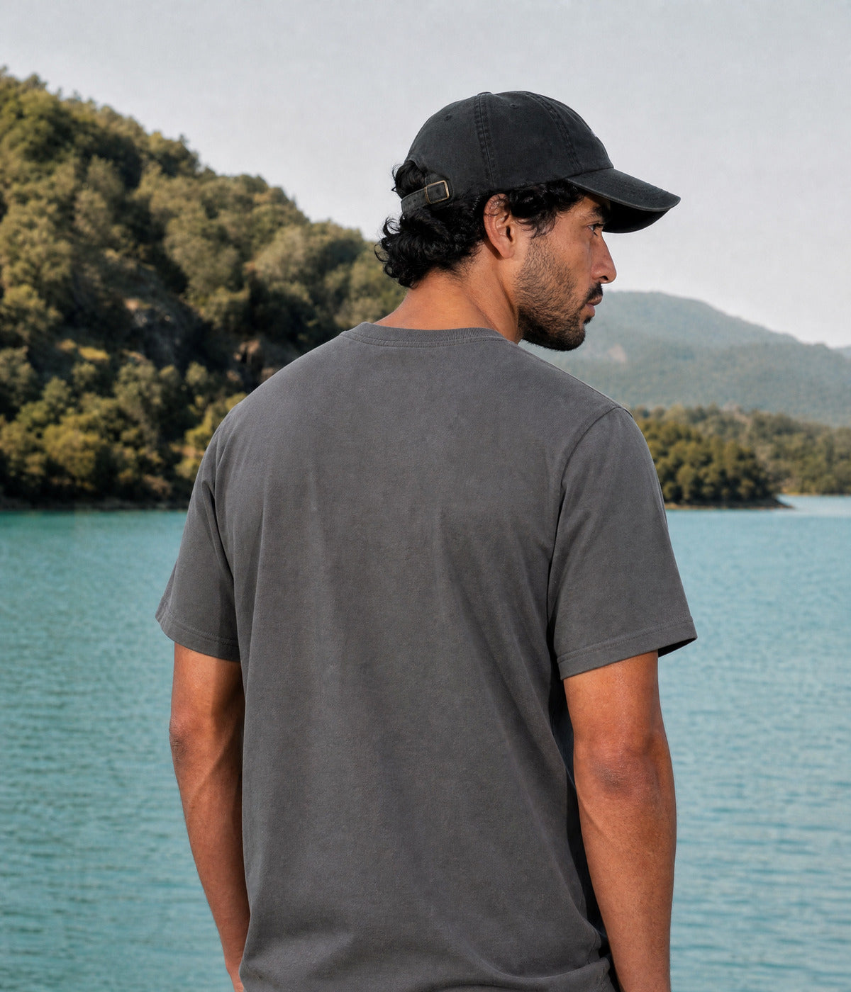 ARABIC LOVE TEE. DARK GRAY worn by a man, back view