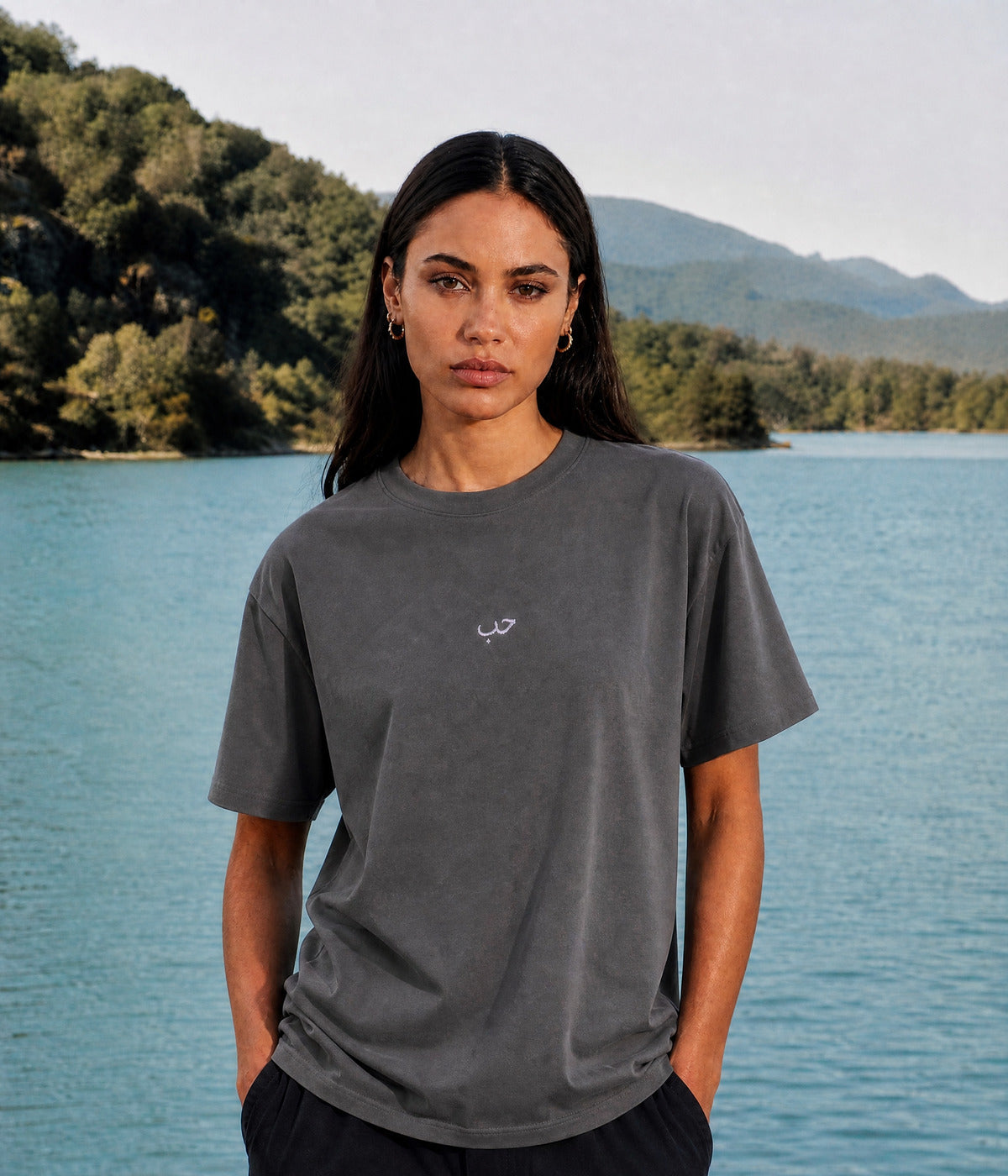 ARABIC LOVE TEE. DARK GRAY worn by a woman