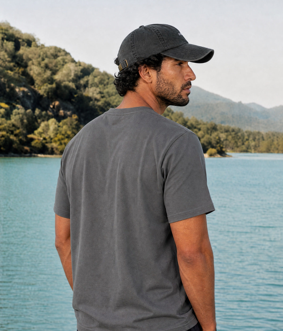 ASTRO TEE. DARK GRAY worn by a man, back view