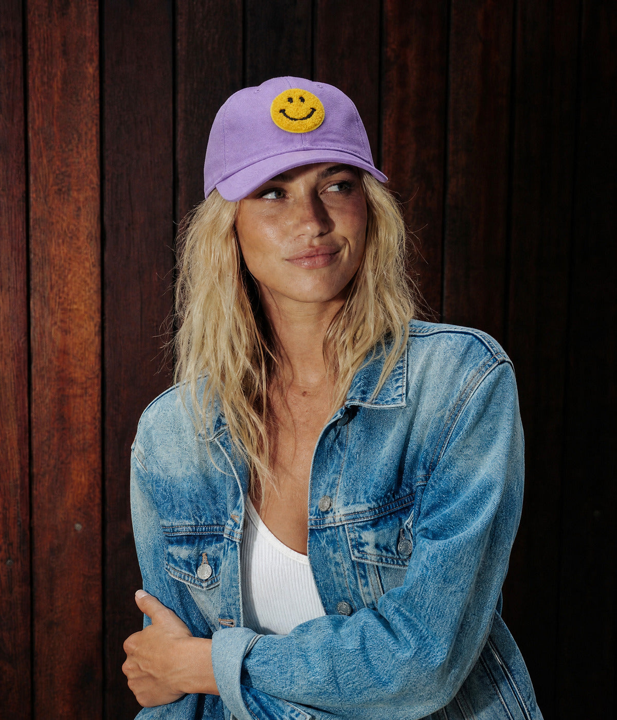 BIG SMILE. PURPLE worn by a woman