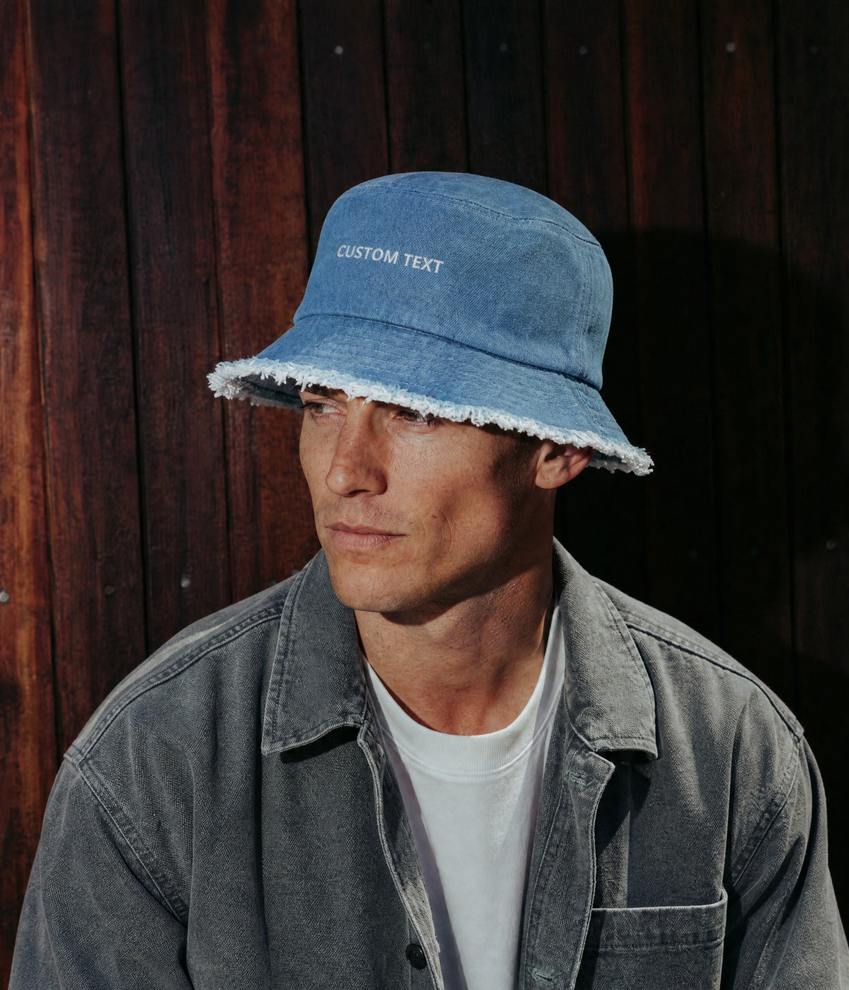 CUSTOM DISTRESSED DENIM BUCKET. LIGHT worn by a man