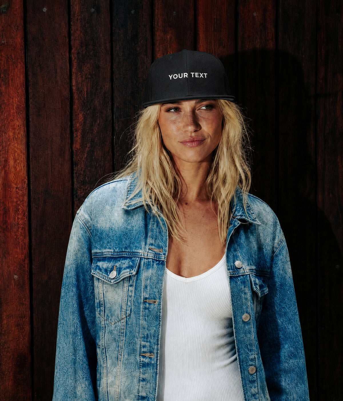 CUSTOM SNAPBACK. BLACK worn by a woman