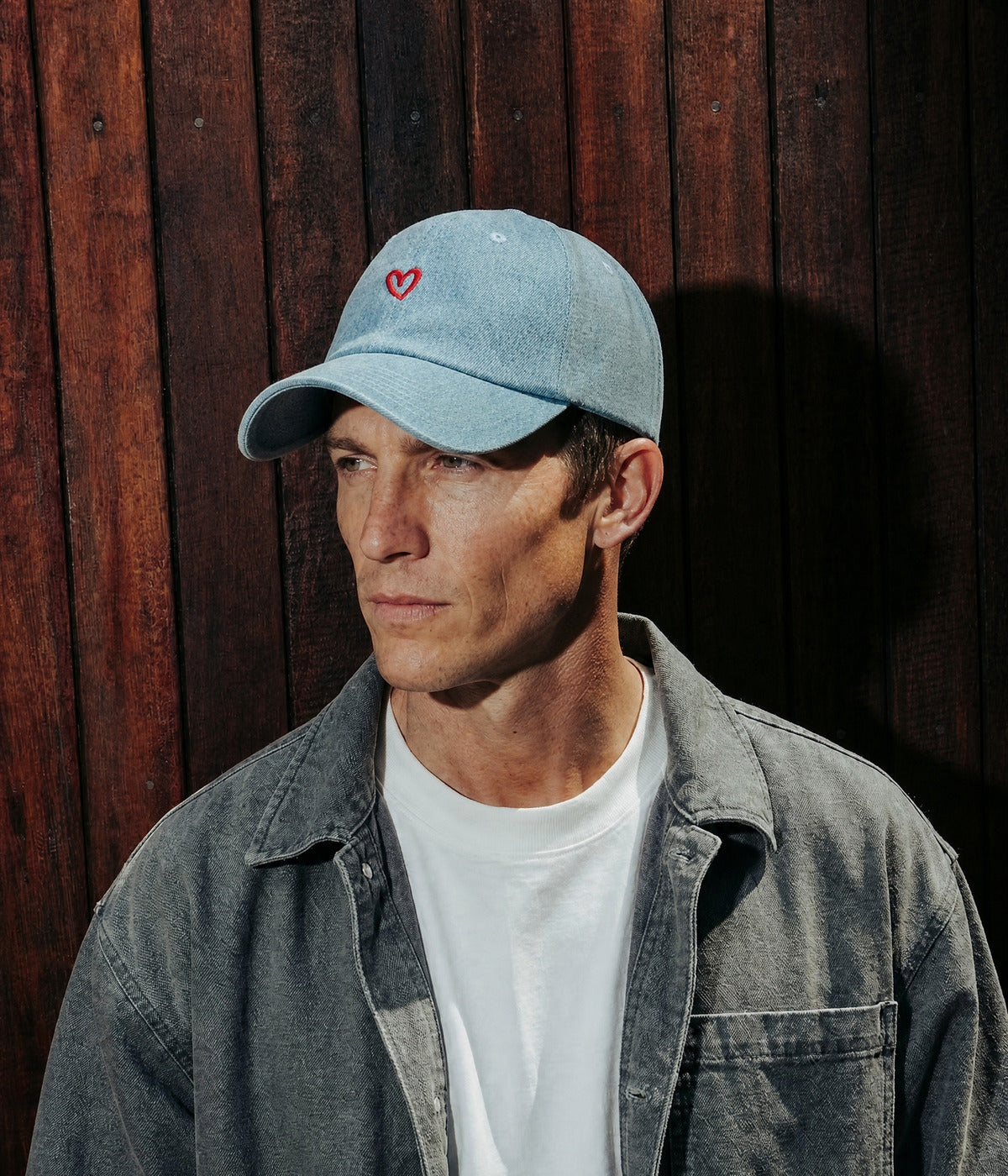DENIM DRAWN HEART. LIGHT BLUE worn by a man