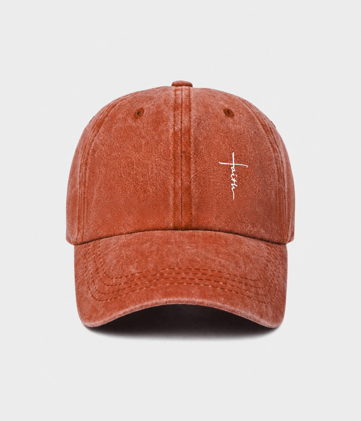 FAITH CROSS. washed cotton cap in RUST, front view