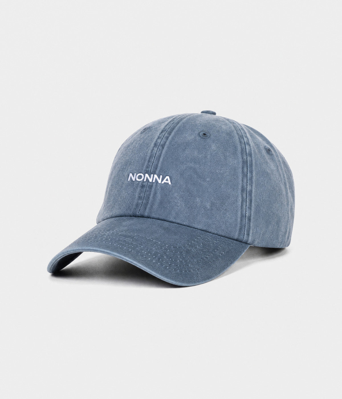 WASHED NONNA. washed cotton dad cap in NAVY, side view