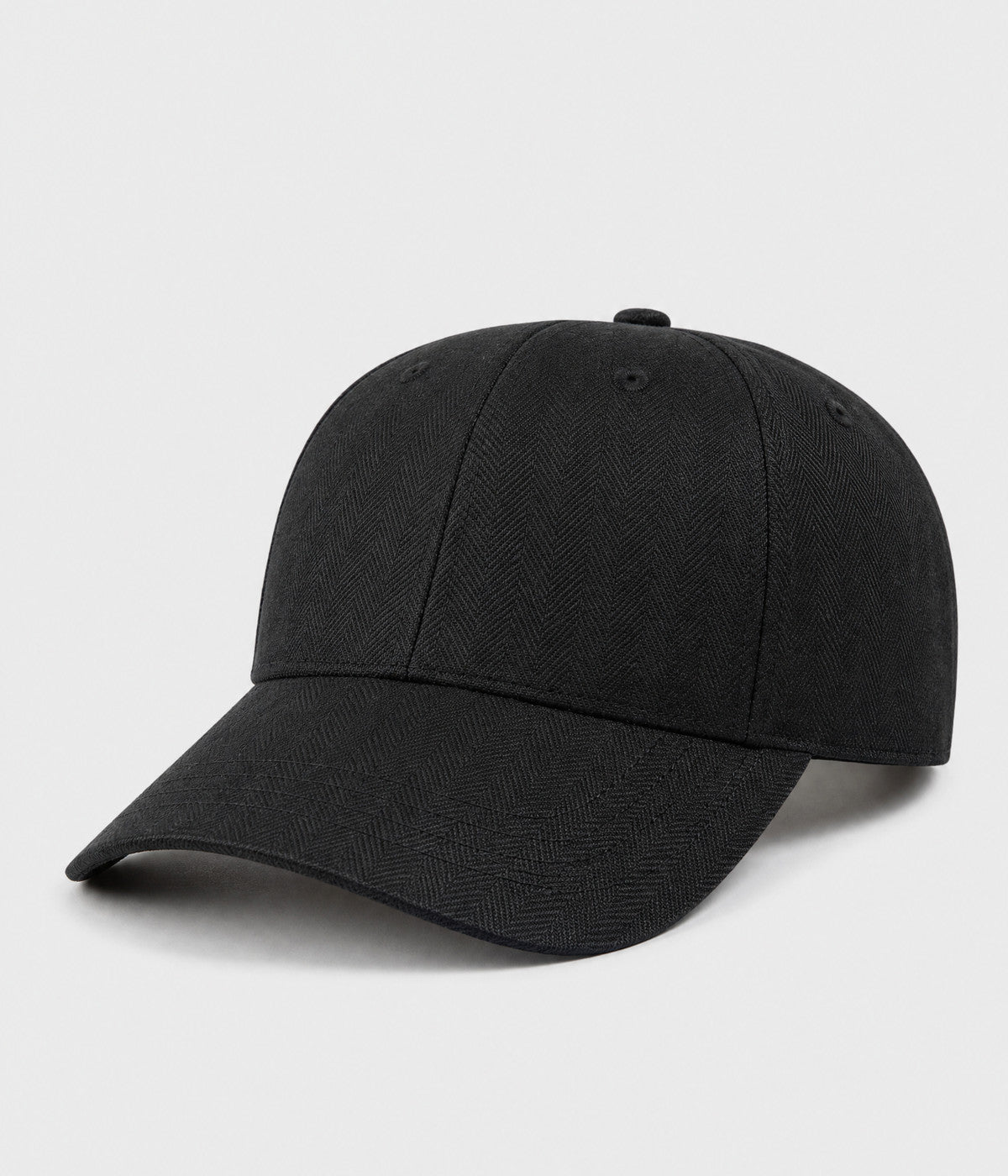 HERRINGBONE LINEN CAP. herringbone linen cap in black, side view