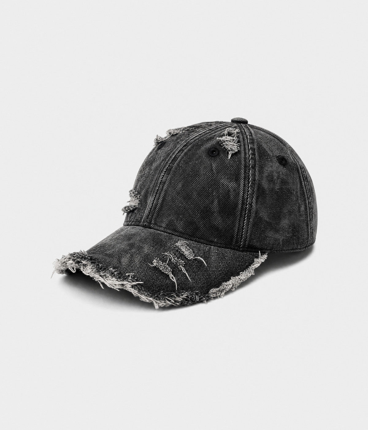 SHREDDED DENIM. acid-wash cotton denim cap in black, side view