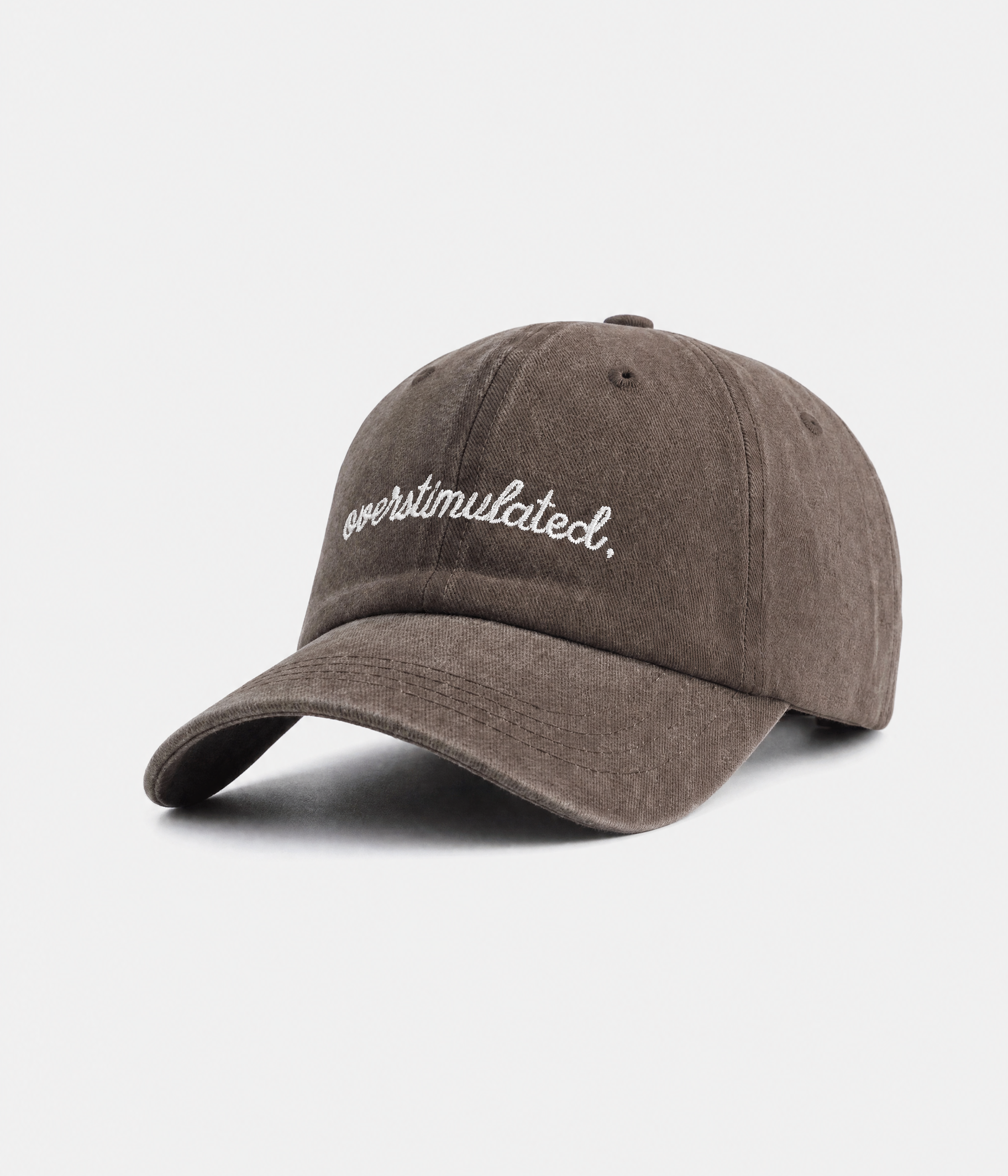 OVERSTIMULATED. washed cotton dad cap in coffee, side view