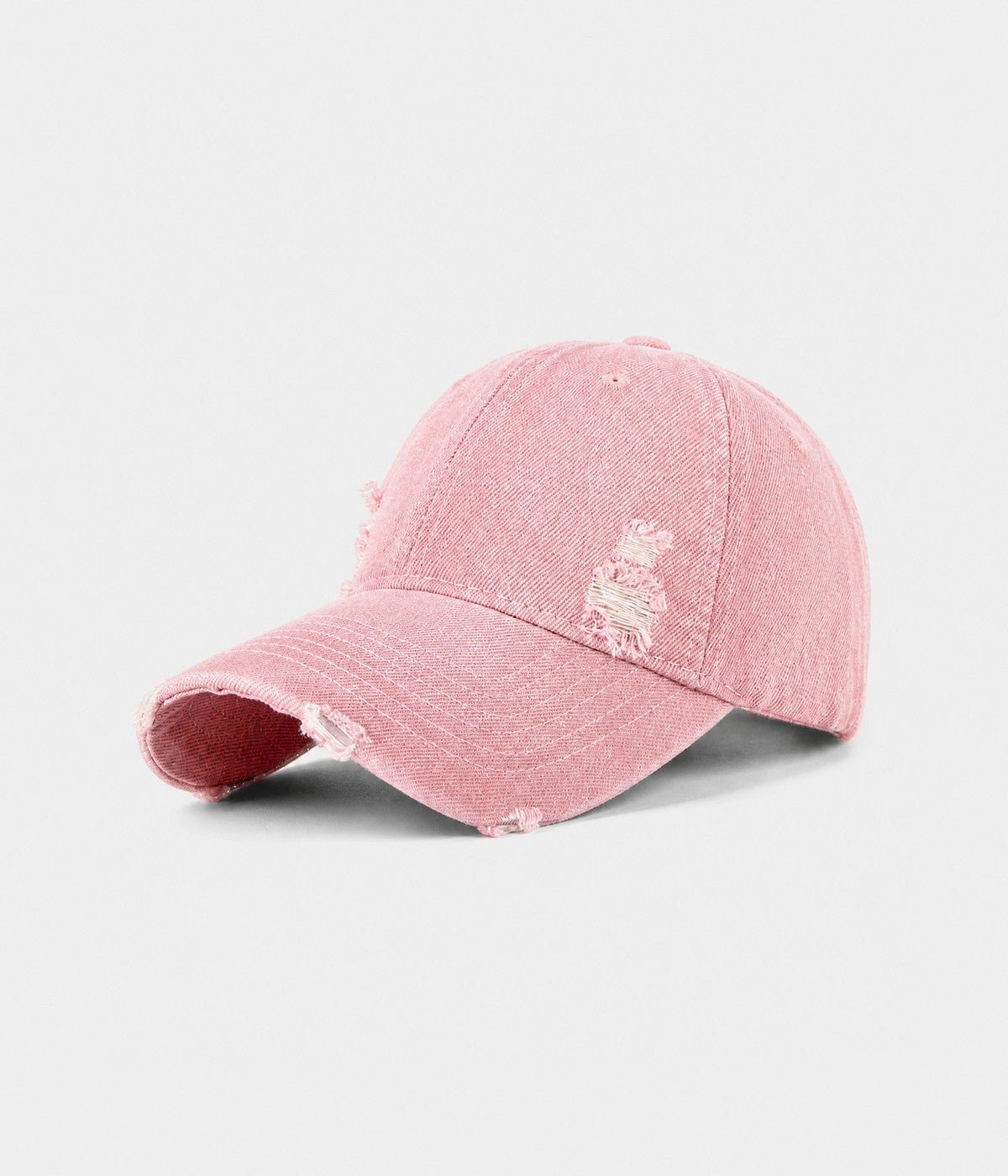 RIPPED DENIM. washed cotton denim cap in pink, side view