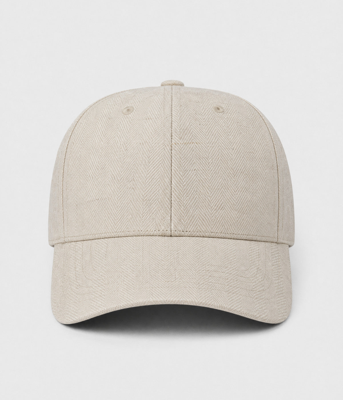 HERRINGBONE LINEN CAP. herringbone linen cap in beige, front view