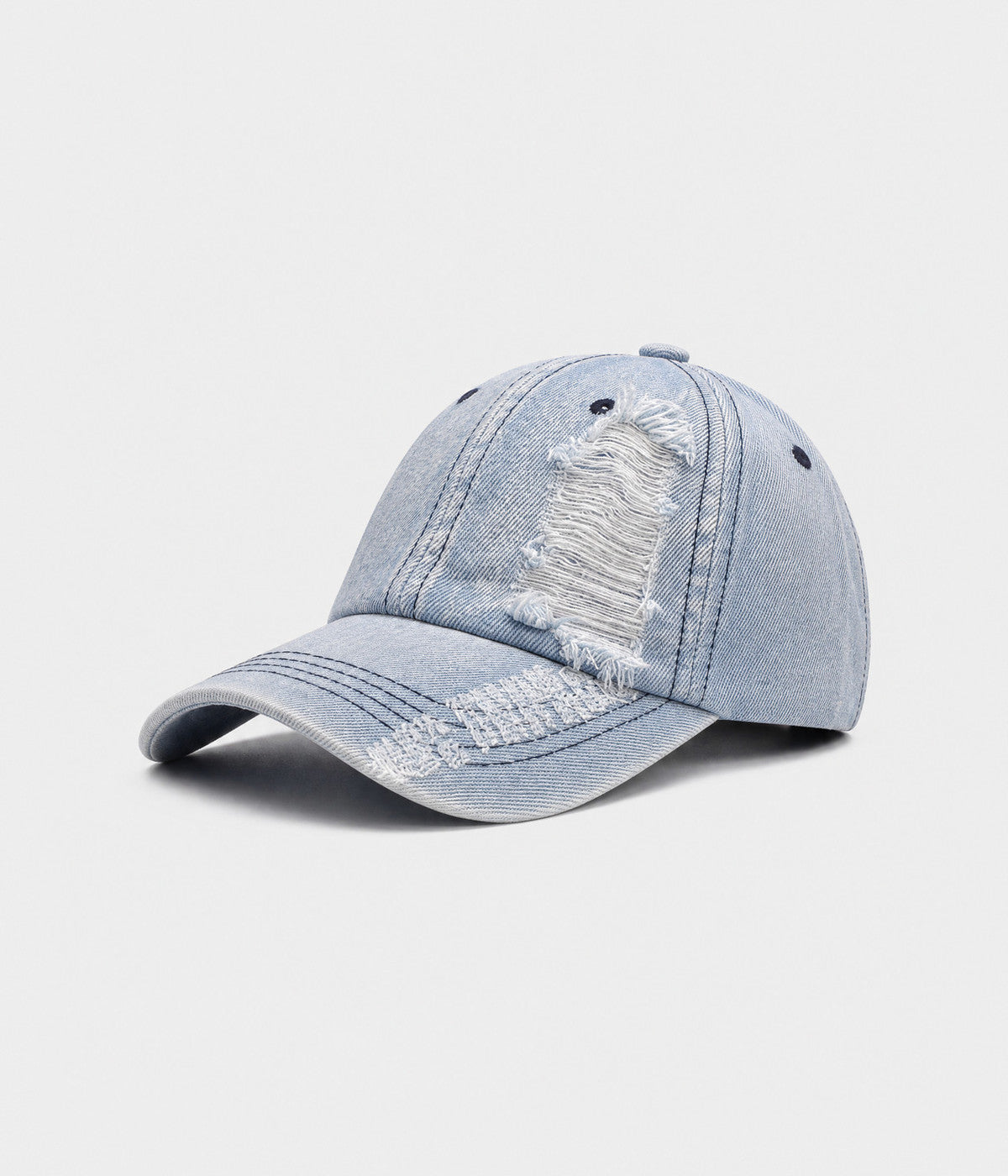 TORN DENIM. washed cotton denim cap in light blue, side view
