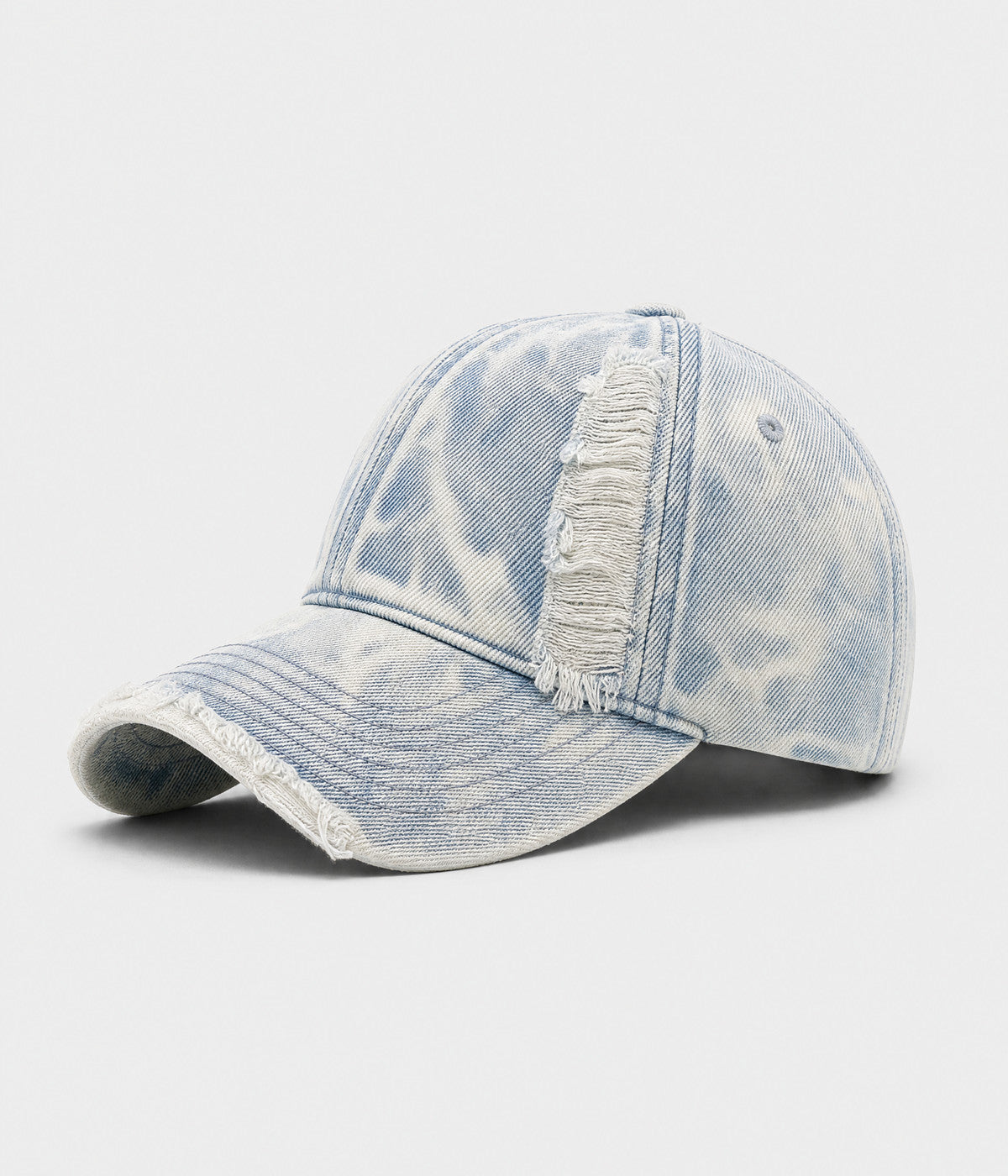 SNOW WASH DENIM. acid-washed denim cap in light blue, side view