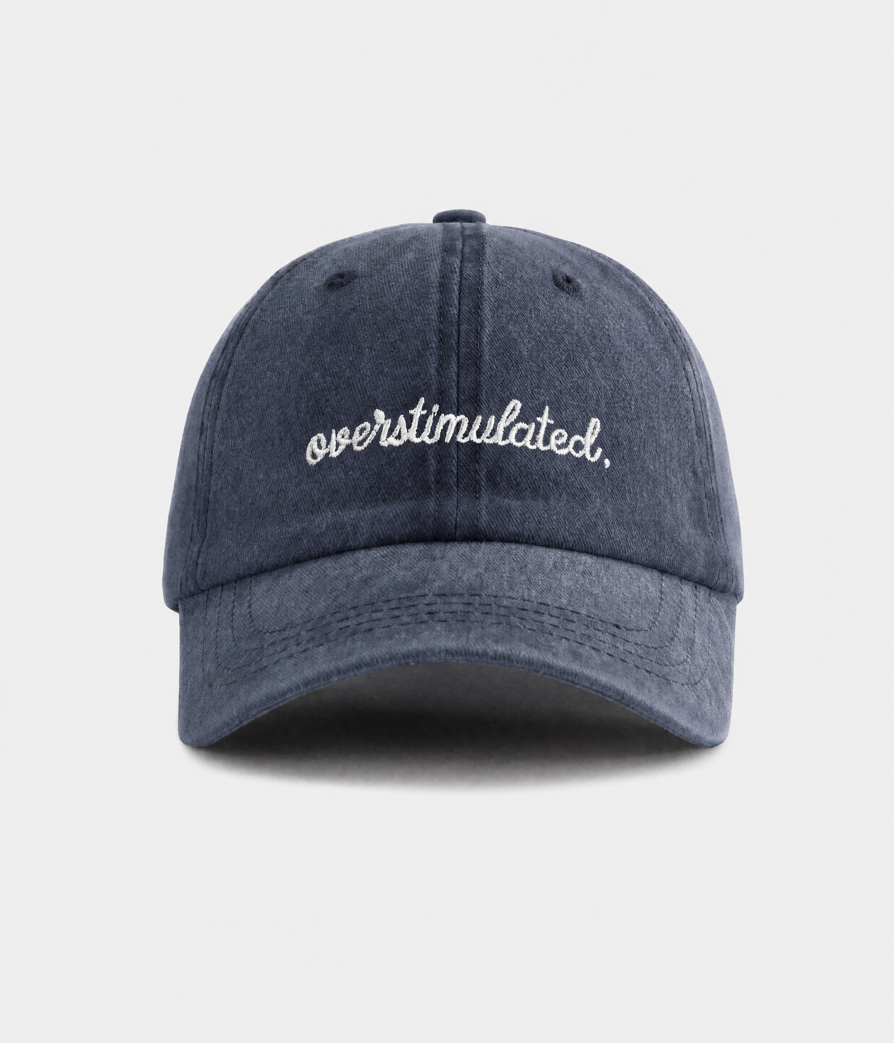 OVERSTIMULATED. washed cotton dad cap in navy, front view