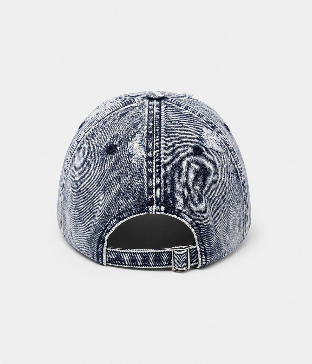 SHREDDED DENIM. acid-wash cotton denim cap in blue, back view