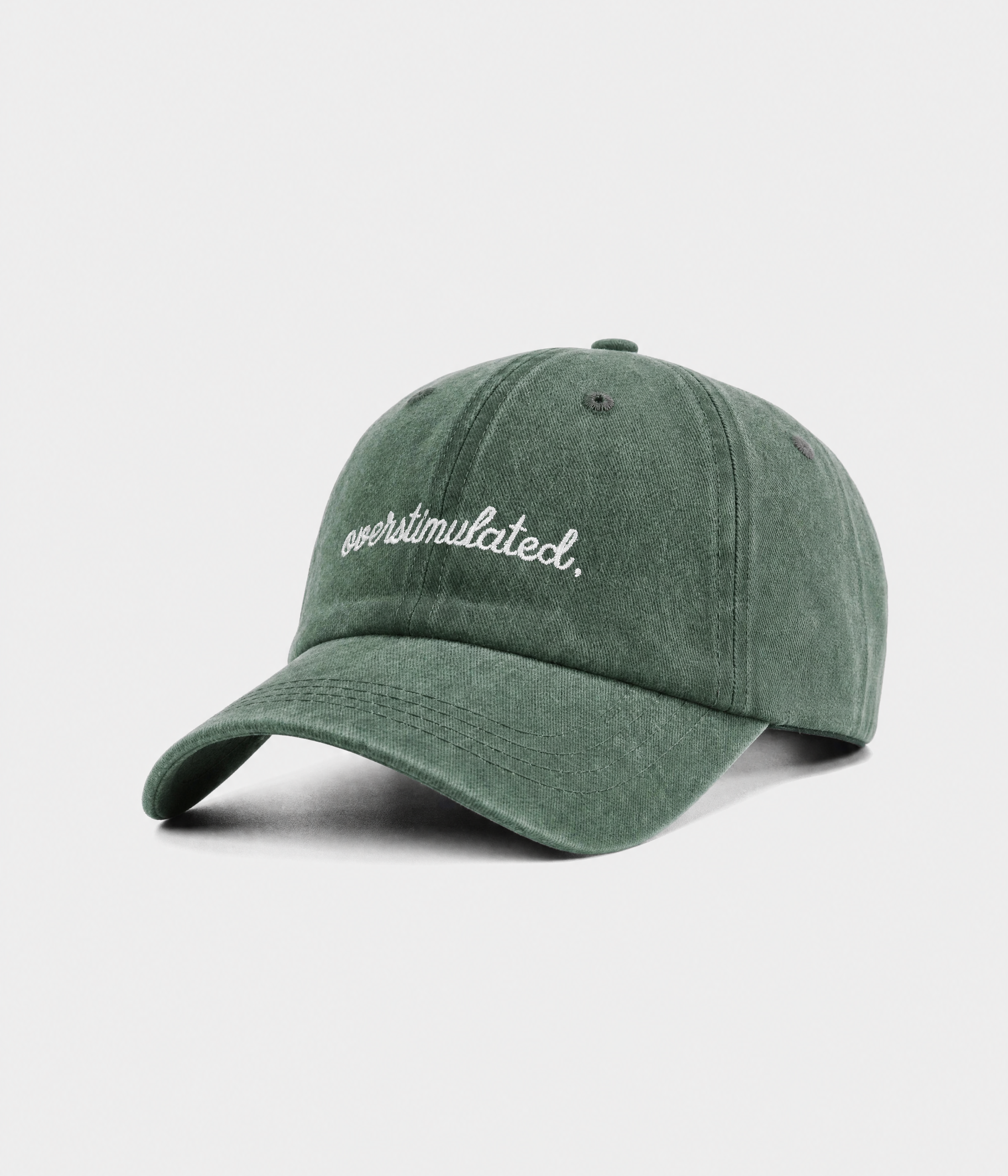 OVERSTIMULATED. washed cotton dad cap in green, side view