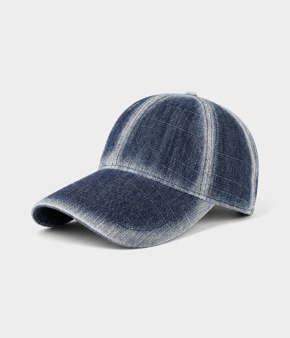 DENIM FADE. washed cotton cap in dark blue, side view