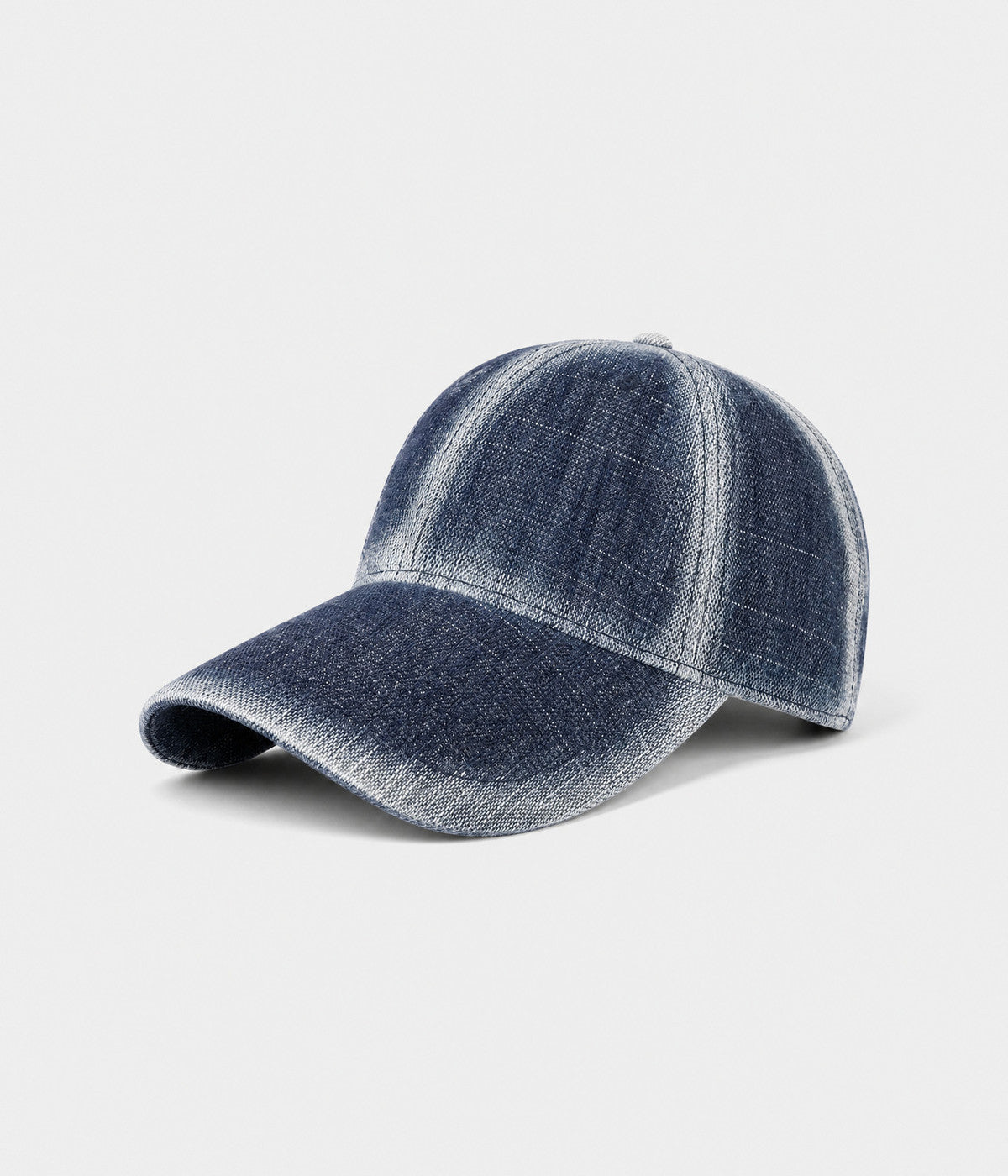 DENIM FADE. washed cotton cap in dark blue, side view