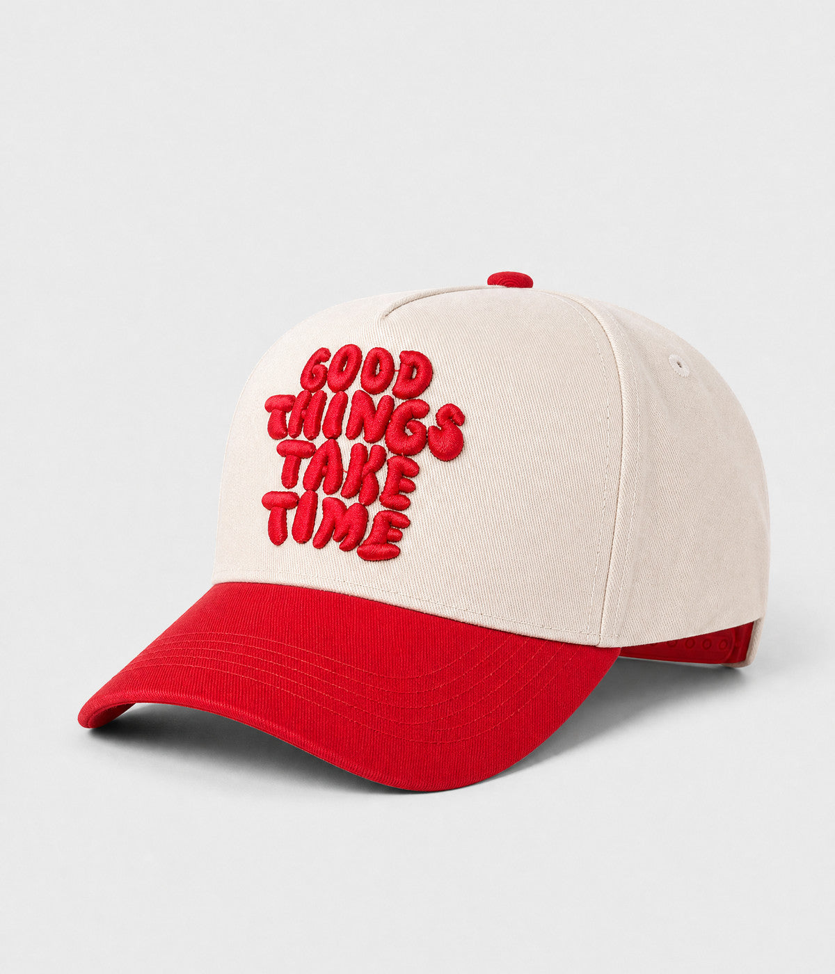 GOOD THINGS TAKE TIME SNAPBACK. cream cotton snapback with RED visor, side view