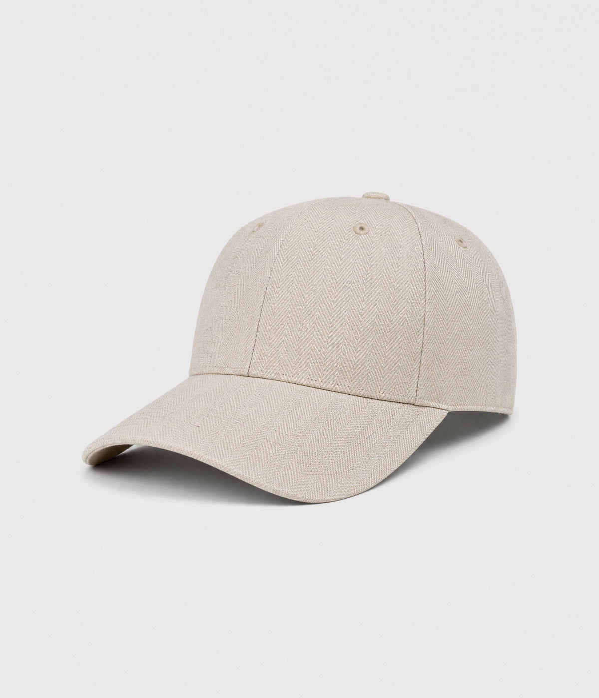 HERRINGBONE LINEN CAP. herringbone linen cap in beige, side view