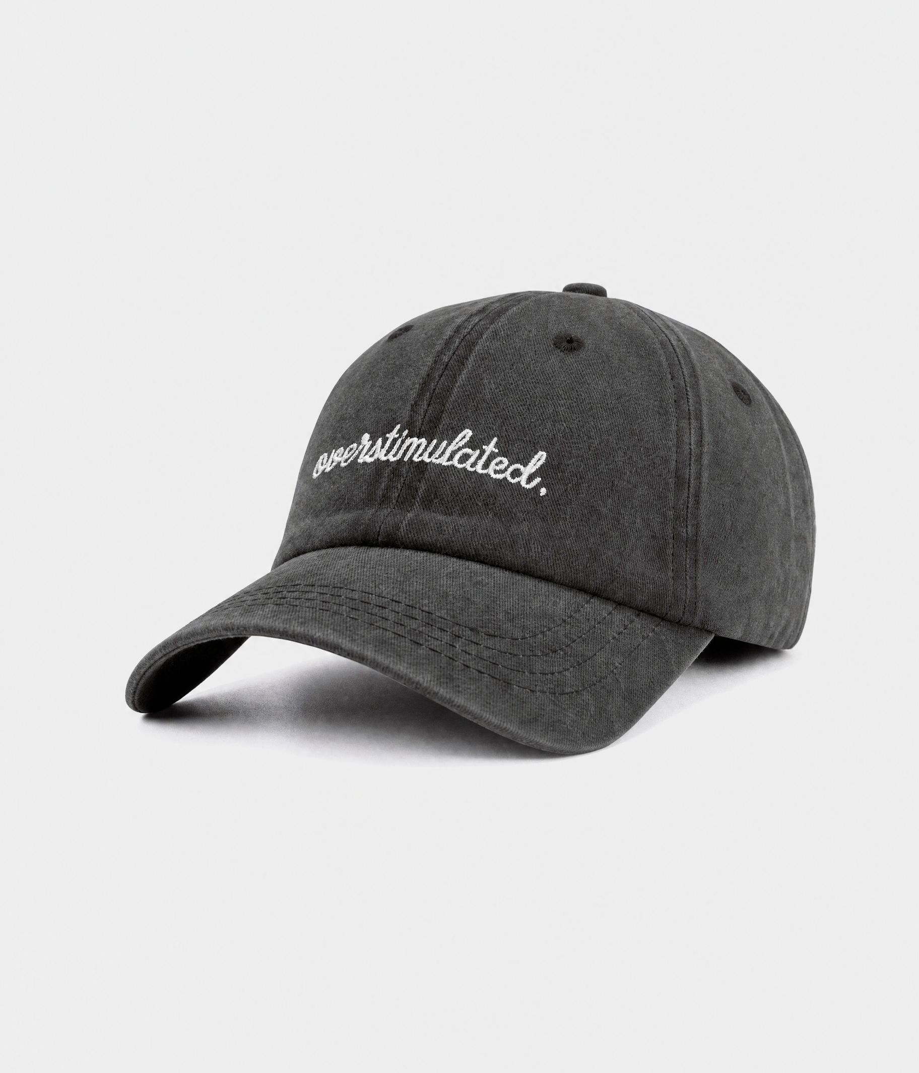OVERSTIMULATED. washed cotton dad cap in black, side view