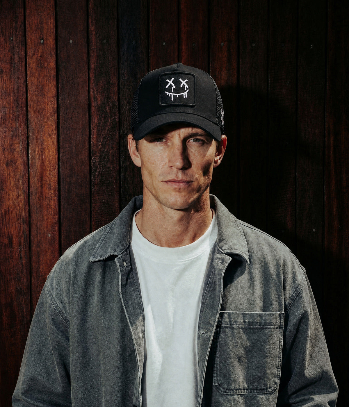 DRIP FACE TRUCKER. — BLACK worn