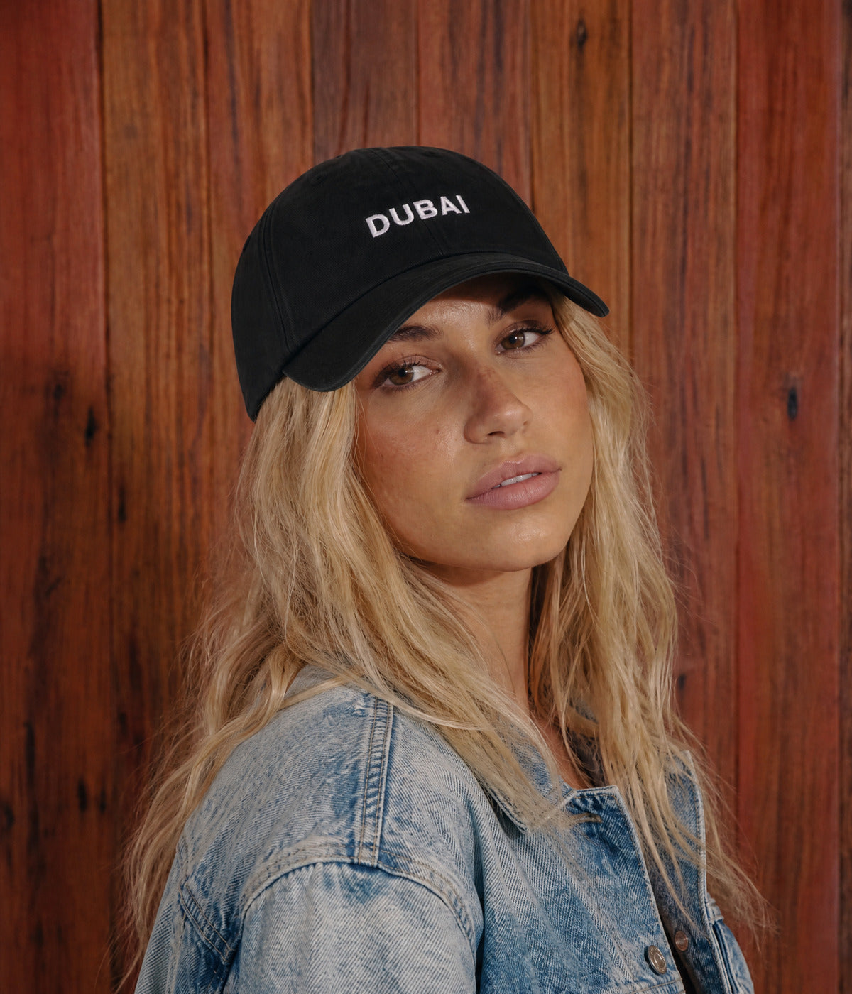 DUBAI CAP. worn by a woman