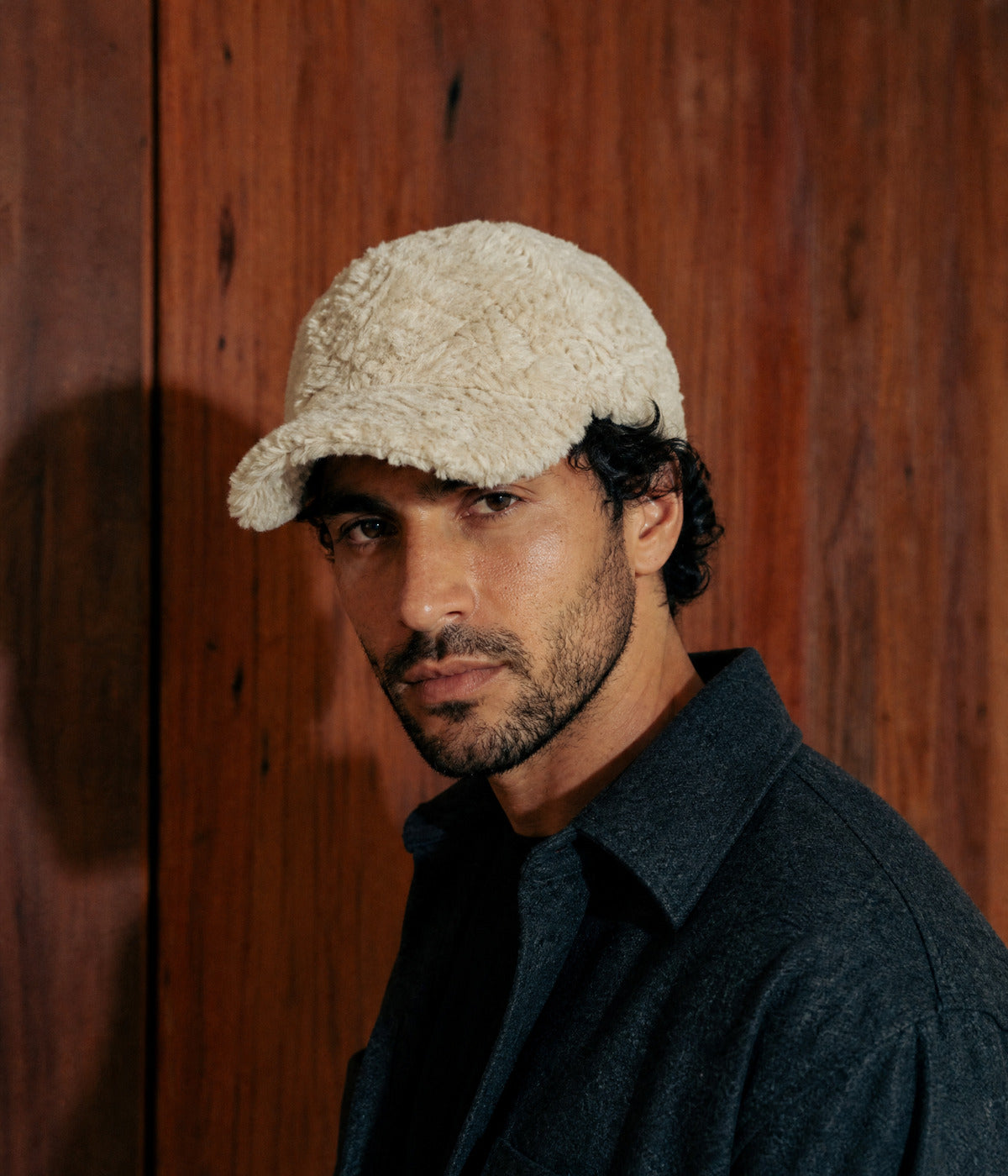 FLUFFY. BEIGE worn by a man