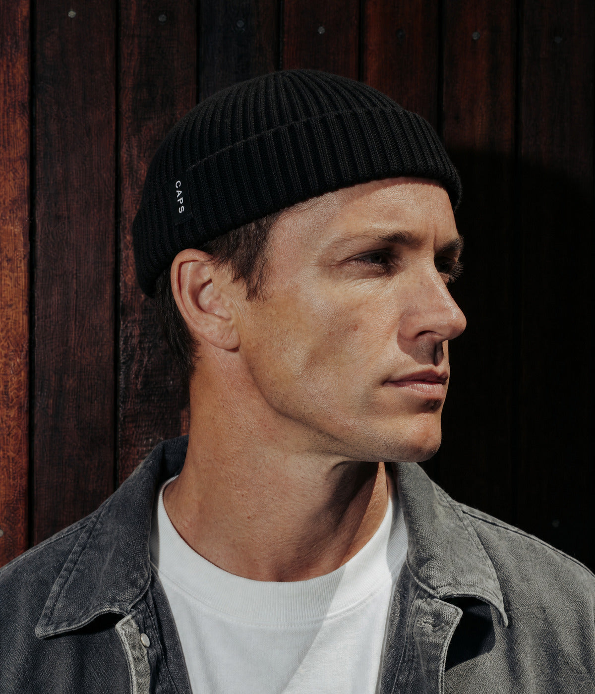 LOGO FISHERMAN BEANIE. — BLACK worn