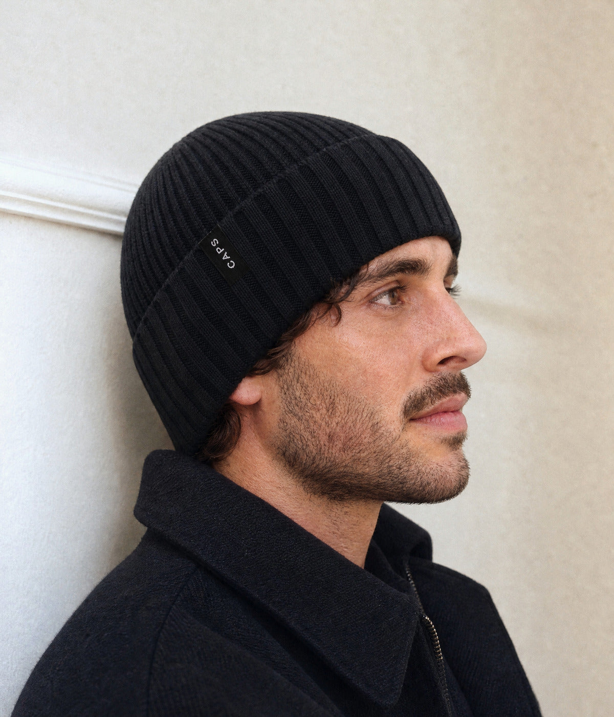 LOGO RIBBED BEANIE. — BLACK worn