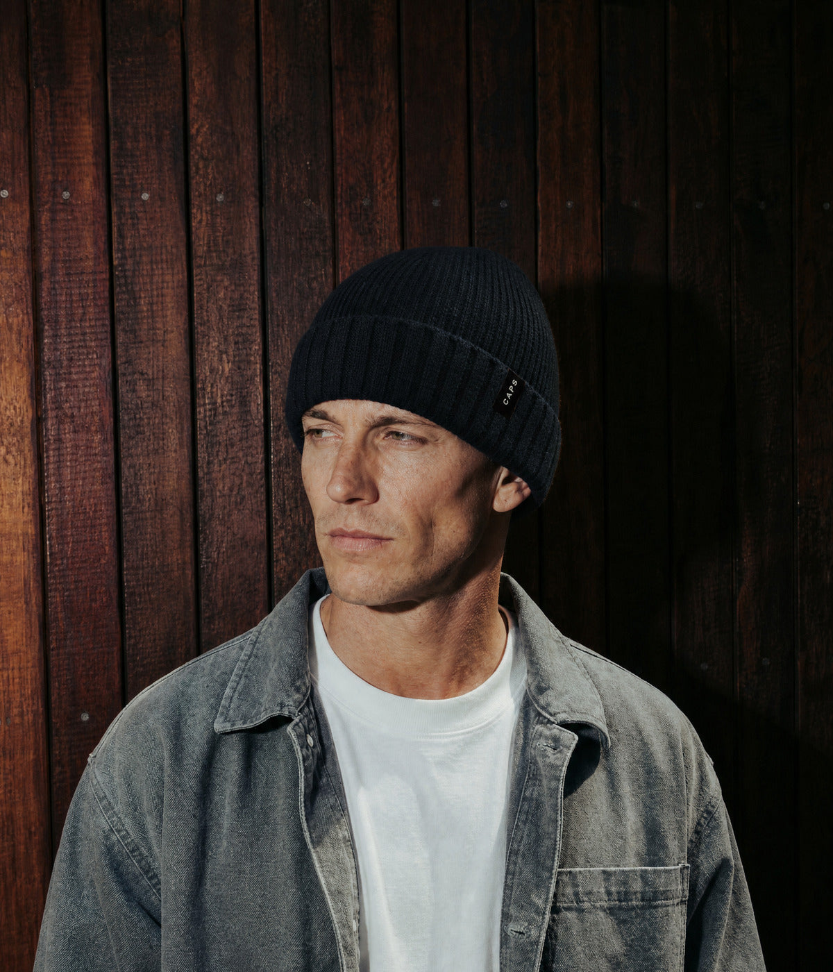 LOGO RIBBED BEANIE. — BLACK worn