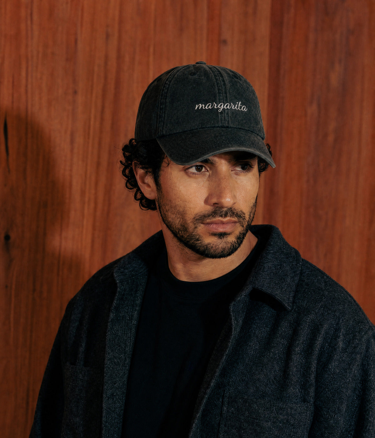 MARGARITA - CURSIVE. BLACK worn by a man
