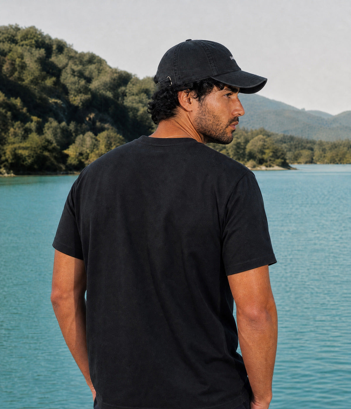 NOT A DJ TEE. BLACK worn by a man, back view