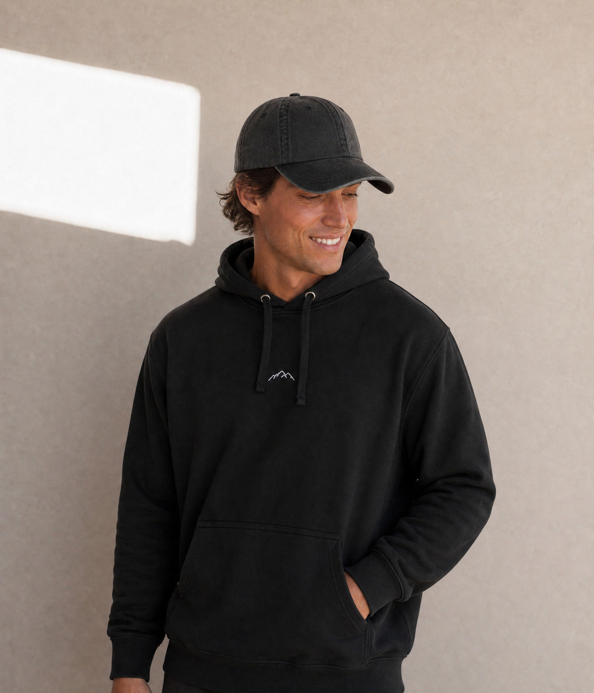 MOUNTAINS HOODIE. on model