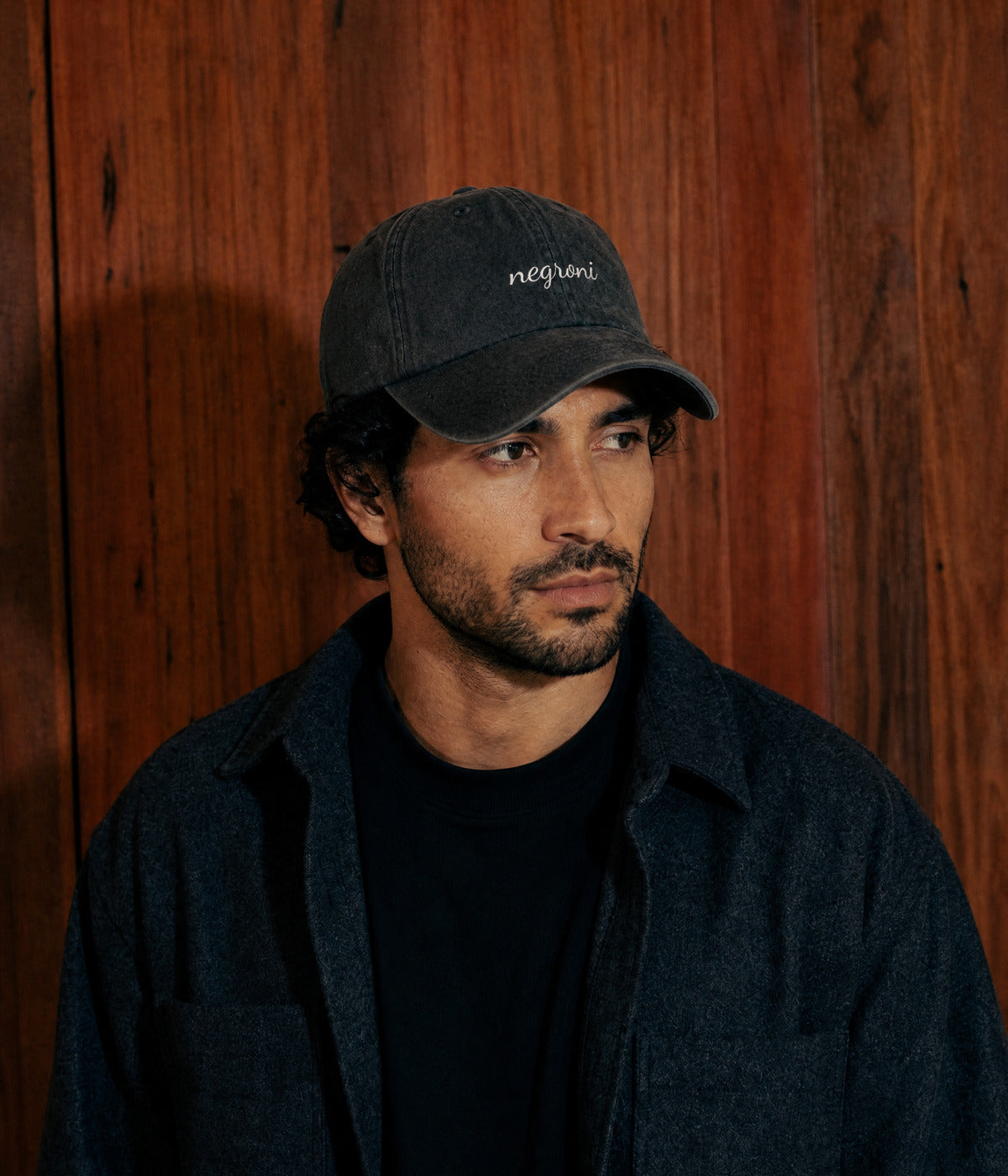 NEGRONI - CURSIVE. BLACK worn by a man