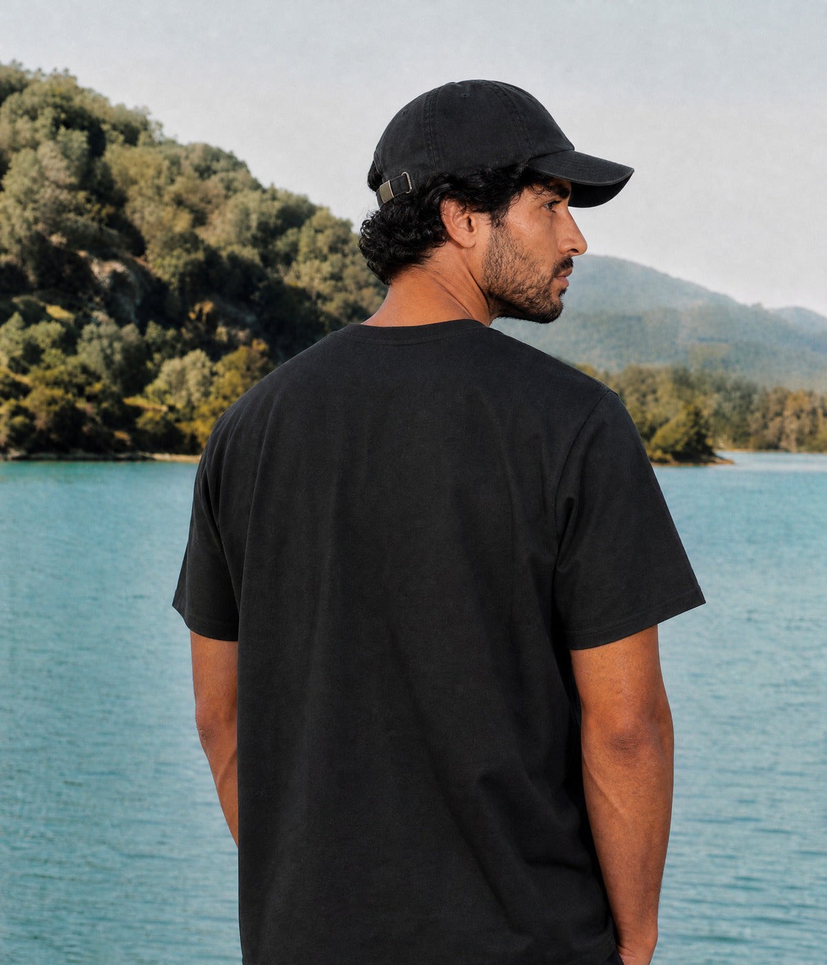 NO TEE. BLACK worn by a man, back view