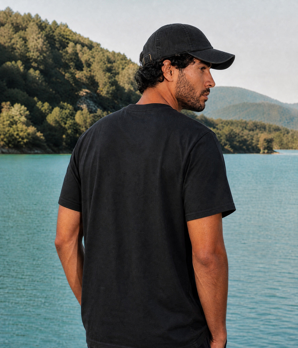 OUT OF OFFICE TEE. BLACK worn by a man, back view