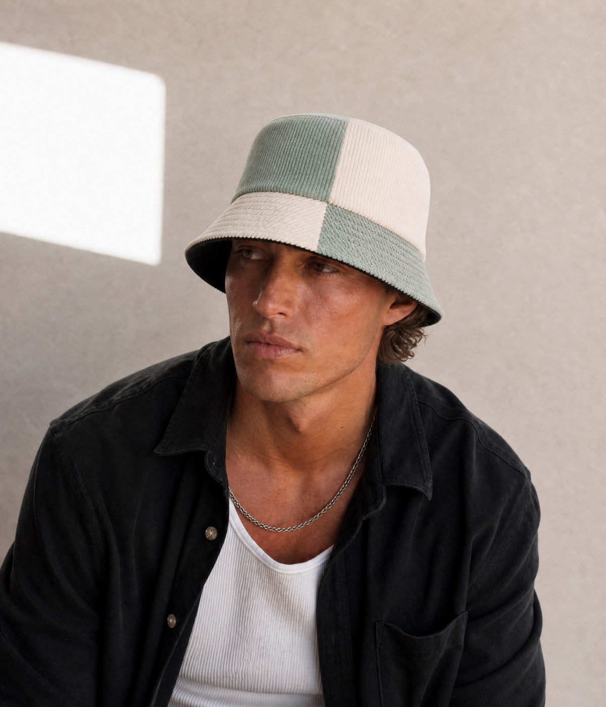 PATCHWORK BUCKET. SAGE BEIGE worn by a man