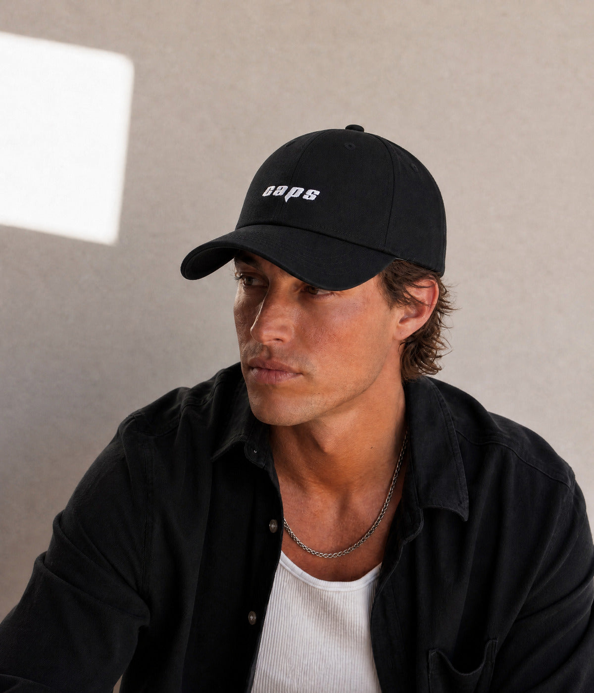 LOGO DAD CAP. worn by a man
