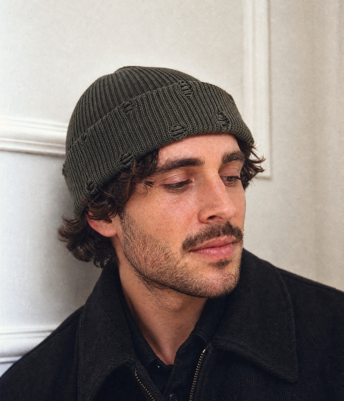 RIPPED FISHERMAN BEANIE. — DARK GREEN worn