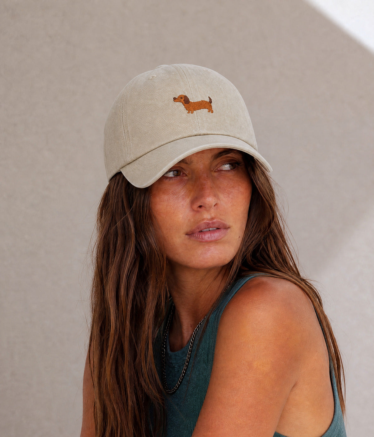 SAUSAGE DOG. BEIGE worn by a woman