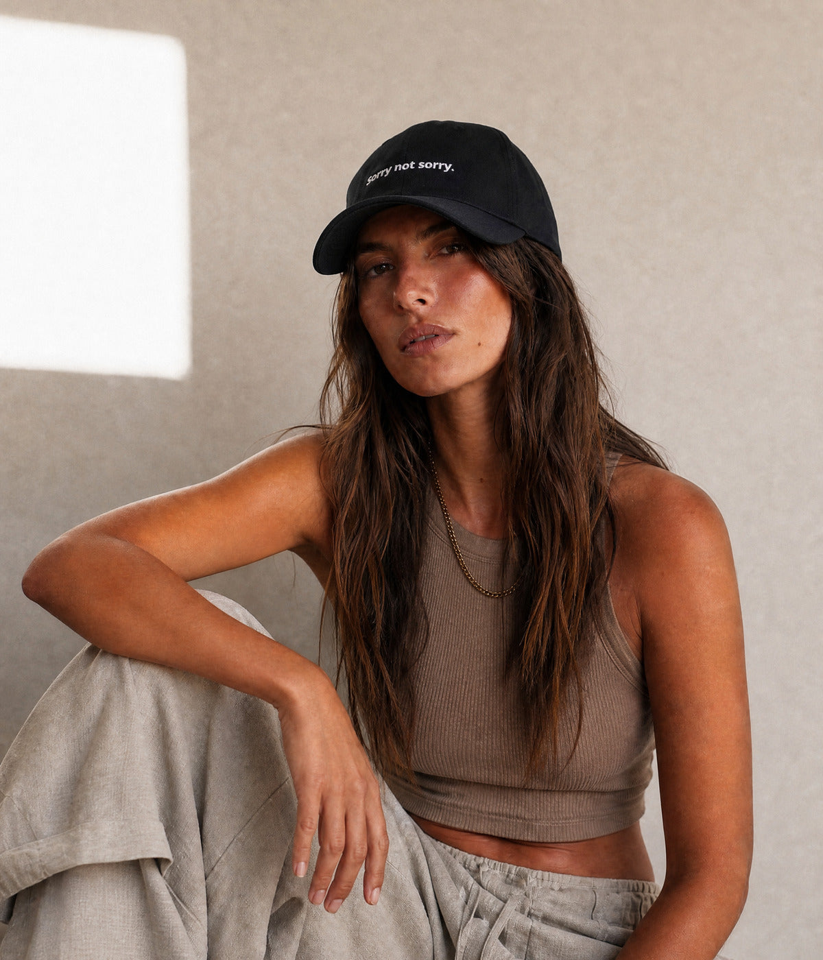 SORRY NOT SORRY. worn by a woman