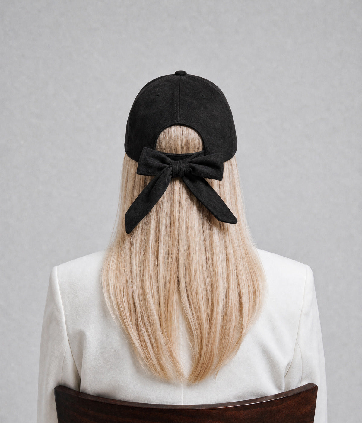 SUEDE BOW CAP. — BLACK worn, back view