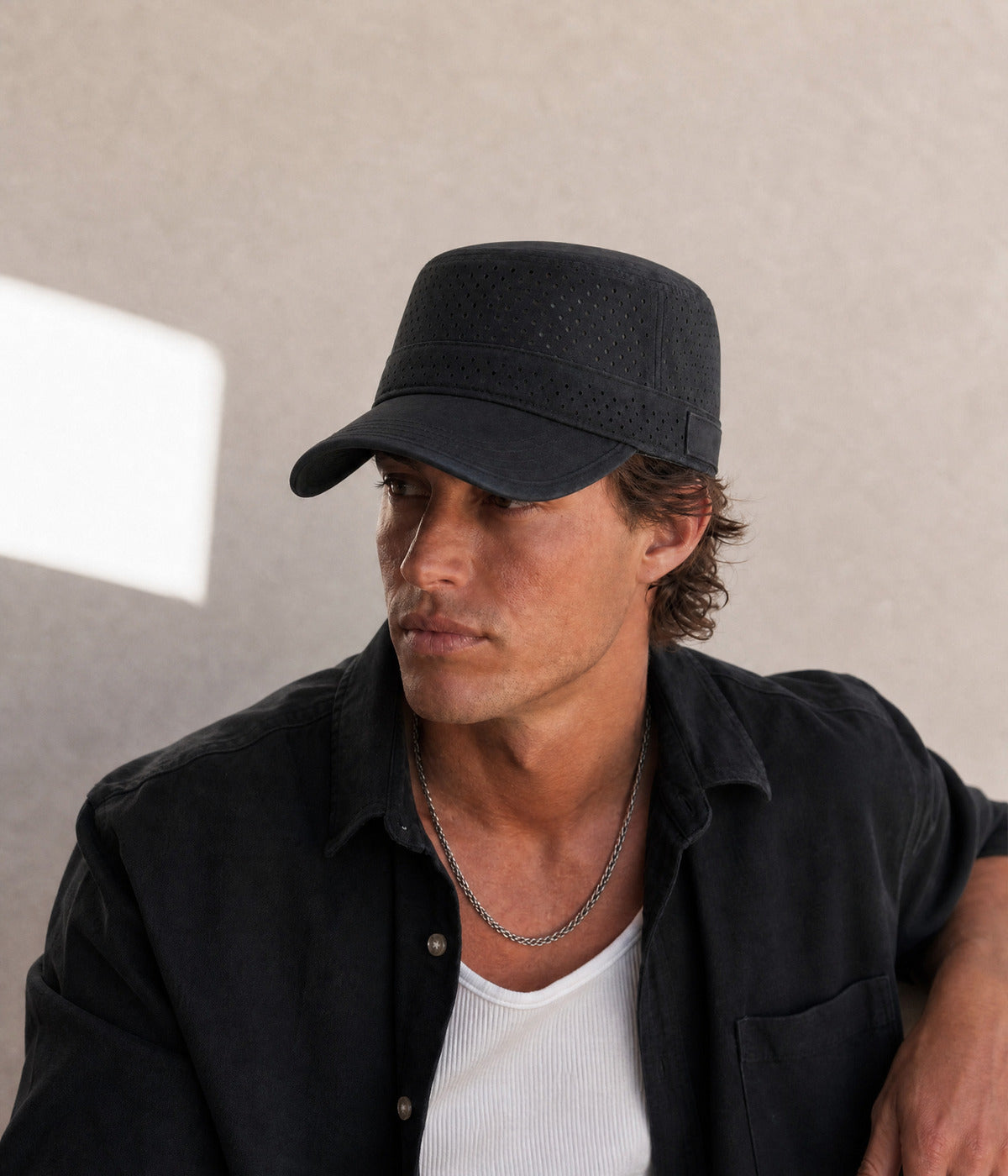 VENTED CADET. BLACK worn by a man