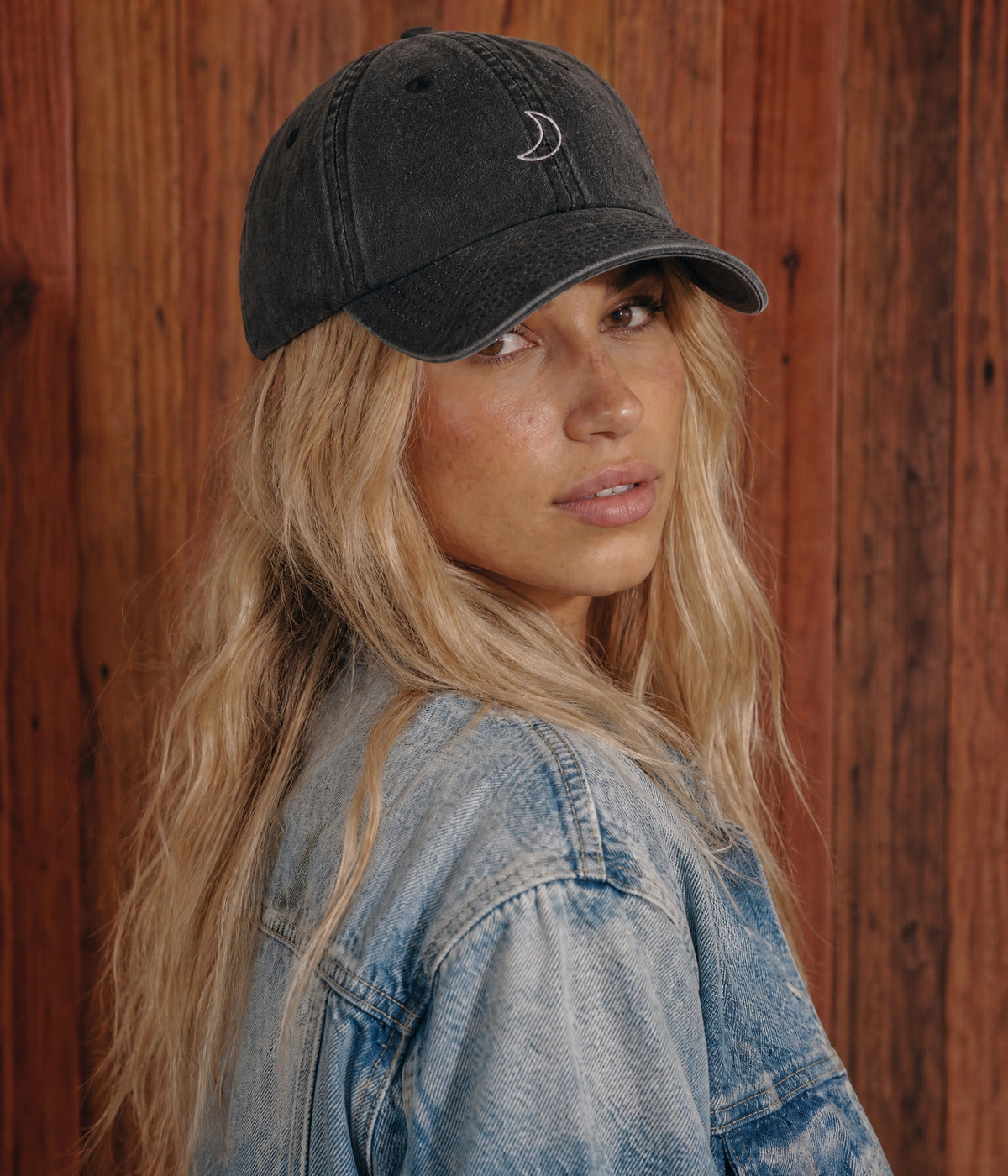 WASHED MOON. BLACK worn by a woman