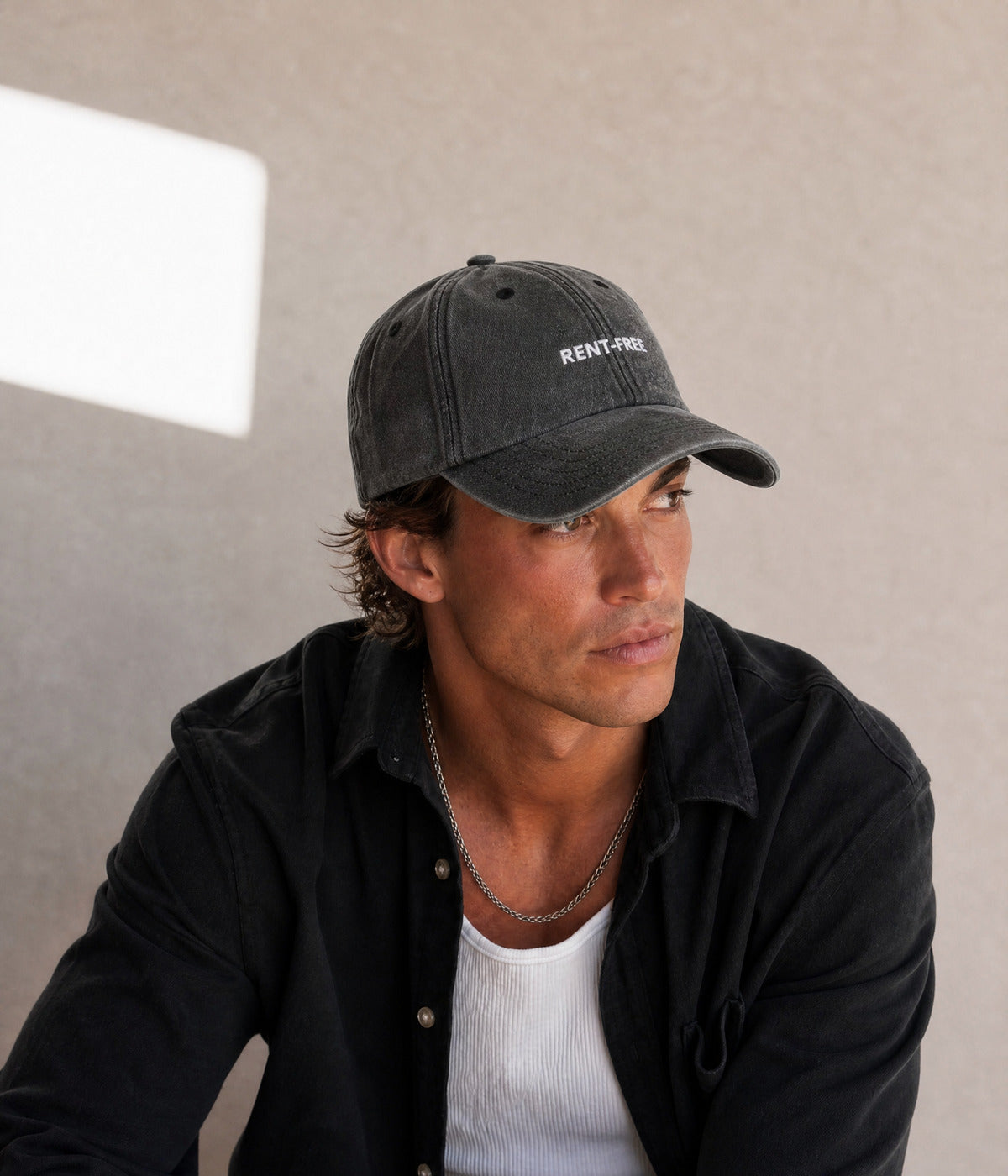 WASHED RENT-FREE. worn by a man