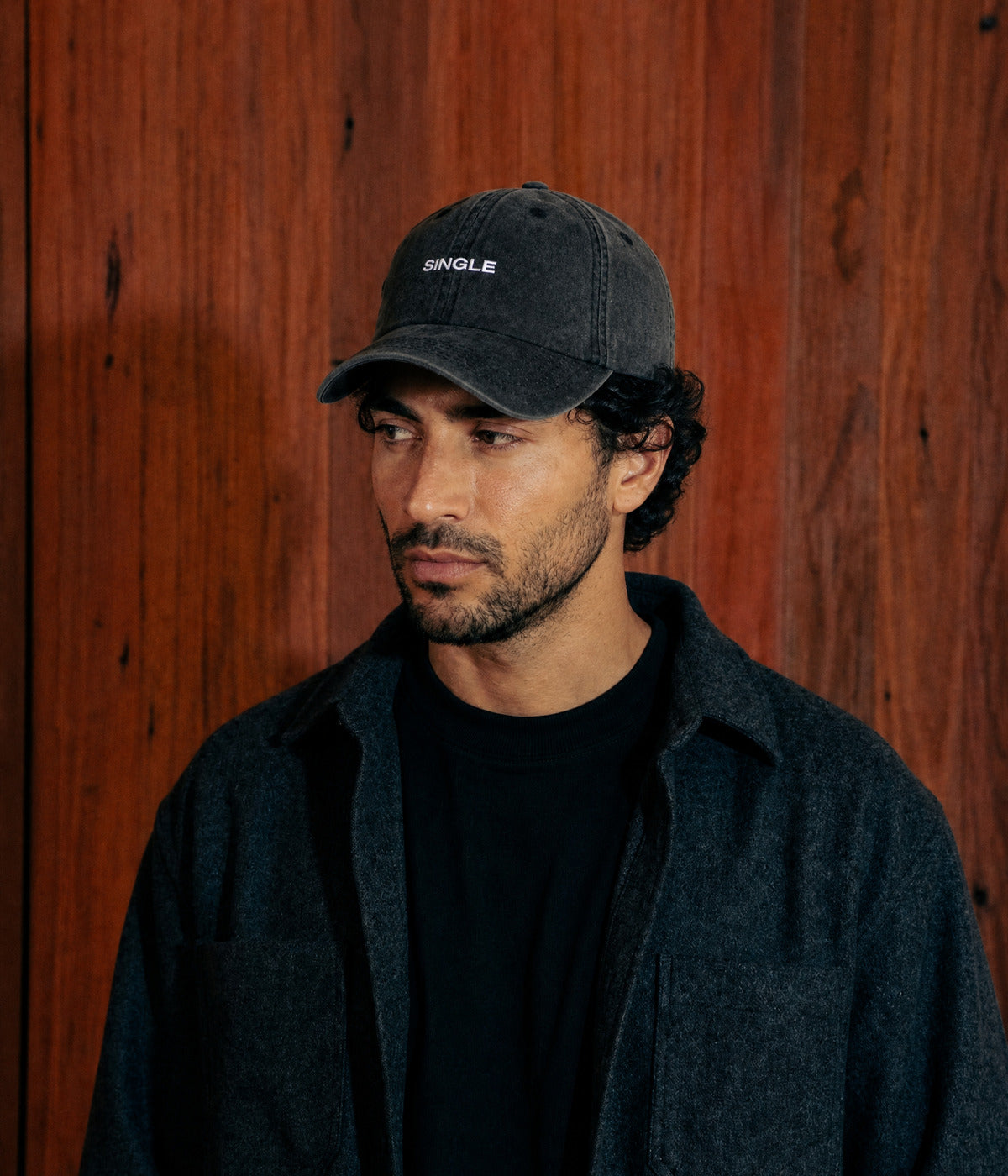 WASHED SINGLE. BLACK worn by a man