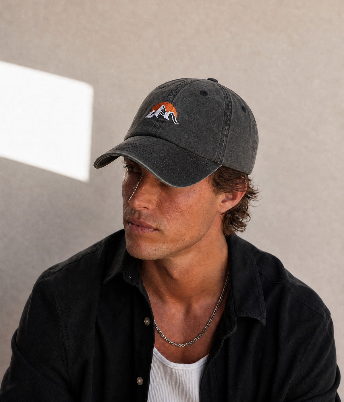 WASHED SUNRISE. BLACK worn by a man